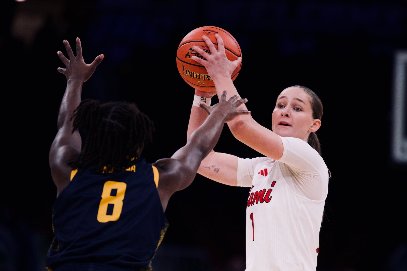 Miami's Amber Scalia looks for a passing lane during her Mid-American Conference championship game against Toledo on Saturday, March 14, 2026, at Rocket Arena in Cleveland. JORDAN PHILLIPS / CONTRIBUTED