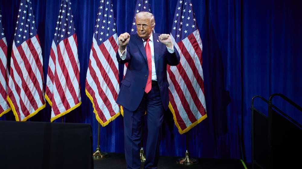 President Donald Trump dances as he walks off stage after speaking to House Republican lawmakers during their annual policy retreat, Tuesday, Jan. 6, 2026, in Washington. (AP Photo/Evan Vucci)