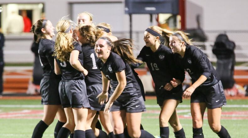 Lakota East celebrates a goal by Abby Stoughton during Tuesday night’s Division I sectional girls soccer final against Loveland at Lakota West. GREG LYNCH/STAFF