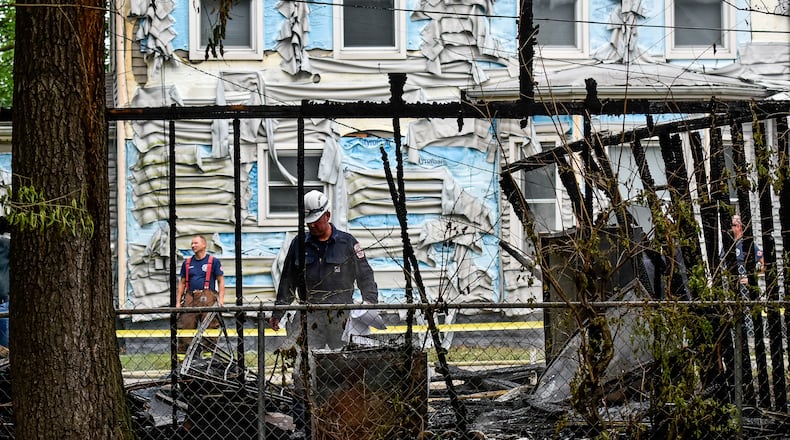 Middletown Police say two men stole a flare gun and shot it into the window of the garage in the 1200 block of Woodside Boulevard on July 5. The fire, which has been ruled an arson, destroyed the garage and damaged three houses. NICK GRAHAM/STAFF