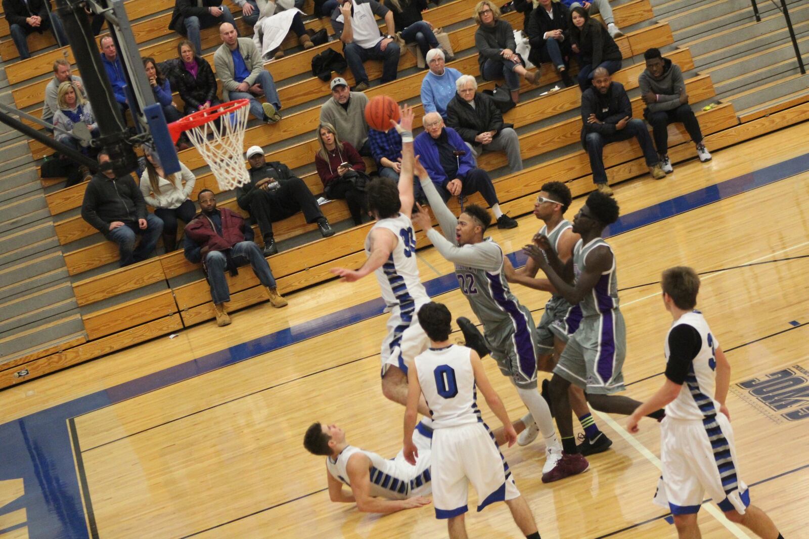 Springboro’s Thomas Arrington (33) goes after a shot by Middletown’s Christian Strother (22) on Saturday night at Springboro. CONTRIBUTED PHOTO BY MARITZA MCKINNEY