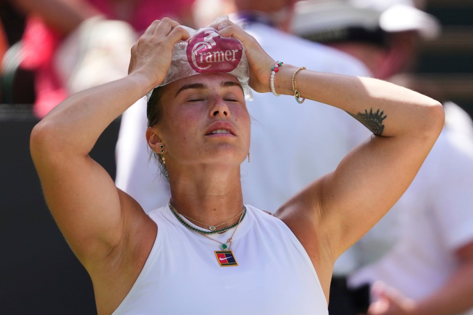 Aryna Sabalenka of Belarus is using an icepack to cool during the women's singles semifinal match against Amanda Anisimova of the U.S. at the Wimbledon Tennis Championships in London, Thursday, July 10, 2025.(AP Photo/Kirsty Wigglesworth)