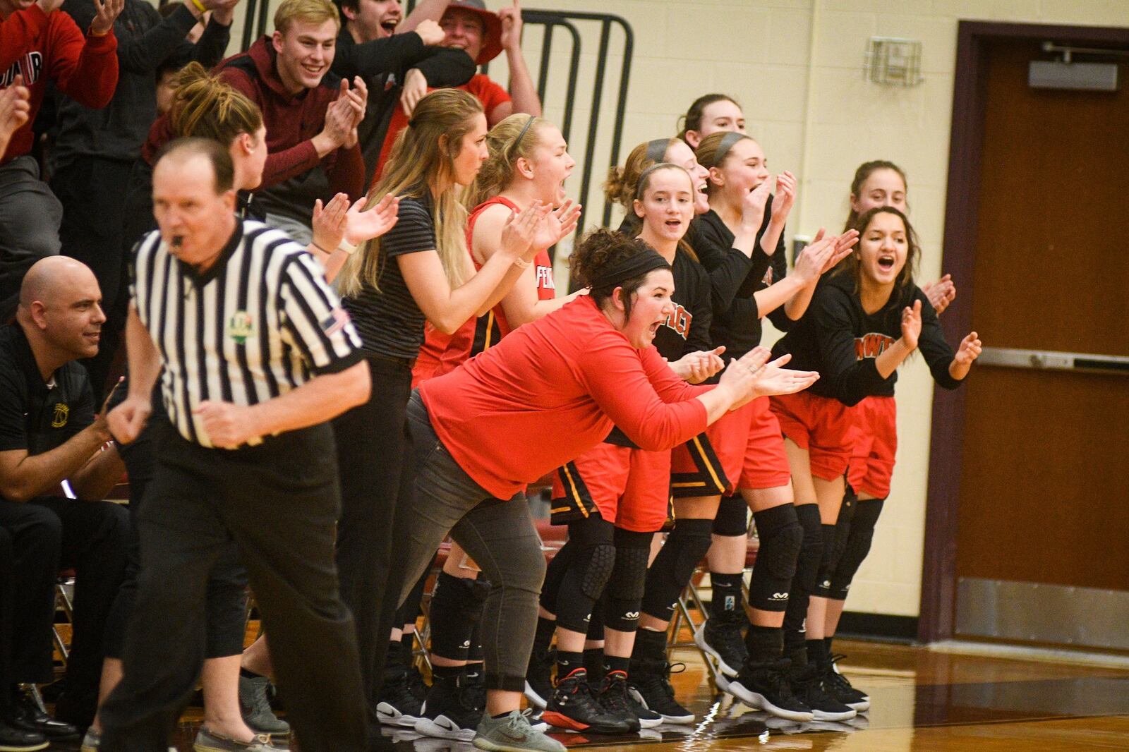 Fenwick’s bench cheers a play during Monday night’s Division II district basketball semifinal against Franklin at Lebanon. Franklin won 47-35. ROB MCCULLEY/RAM PHOTOGRAPHY