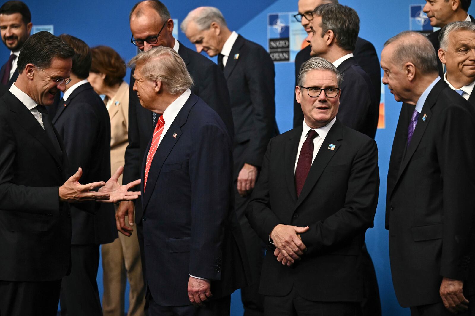 NATO Secretary General Mark Rutte, from left, President Donald Trump, Britain's Prime Minister Keir Starmer and Turkey's President Recep Tayyip Erdogan gather with NATO country leaders for a family photo during the NATO summit in The Hague, Netherlands, Wednesday, June 25, 2025. (Ben Stansall/Pool Photo via AP)