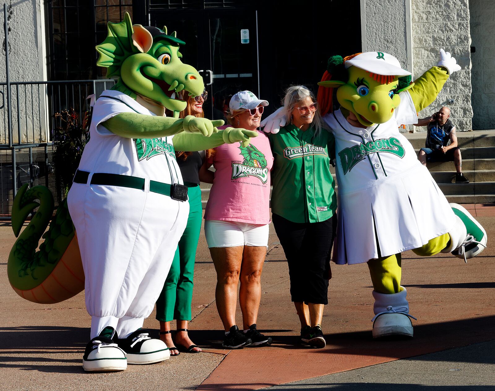 The Dayton Dragons baseball team Mascots Heater and Gem pose for photos with fans before a game Wednesday, Aug. 21, 2024. MARSHALL GORBY\STAFF