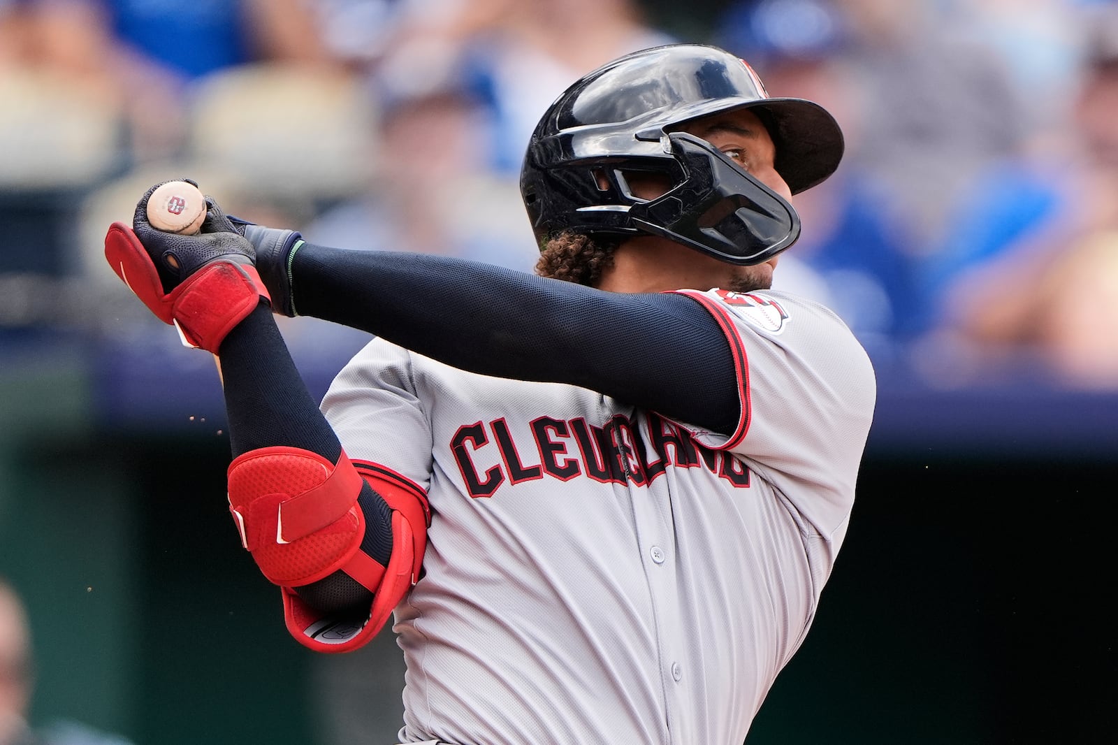 Cleveland Guardians' Bo Naylor watches his RBI double during the seventh inning in the first baseball game of a doubleheader against the Kansas City Royals, Saturday, July 26, 2025, in Kansas City, Mo. (AP Photo/Charlie Riedel)