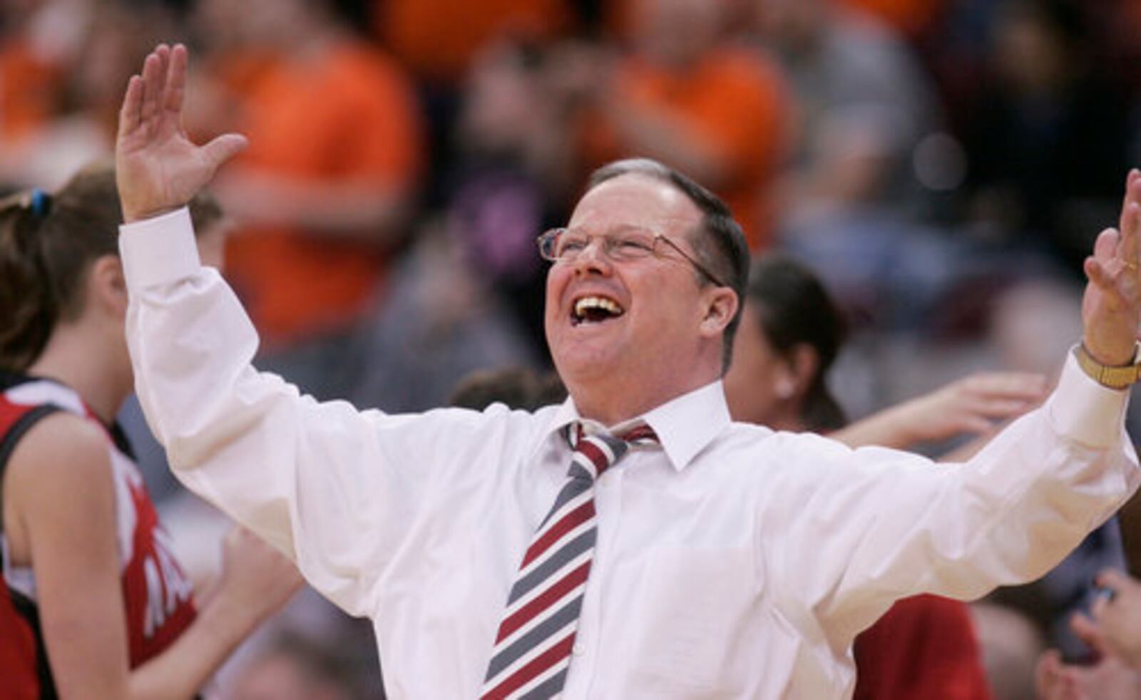 John Rossi, head basketball coach of Madison High School, celebrates earning a trip to the state title game.The Mohawks won a Division III state semifinal game by beating Ironton High School, 50-43. Madison lost in the state final. FILE HOTO 