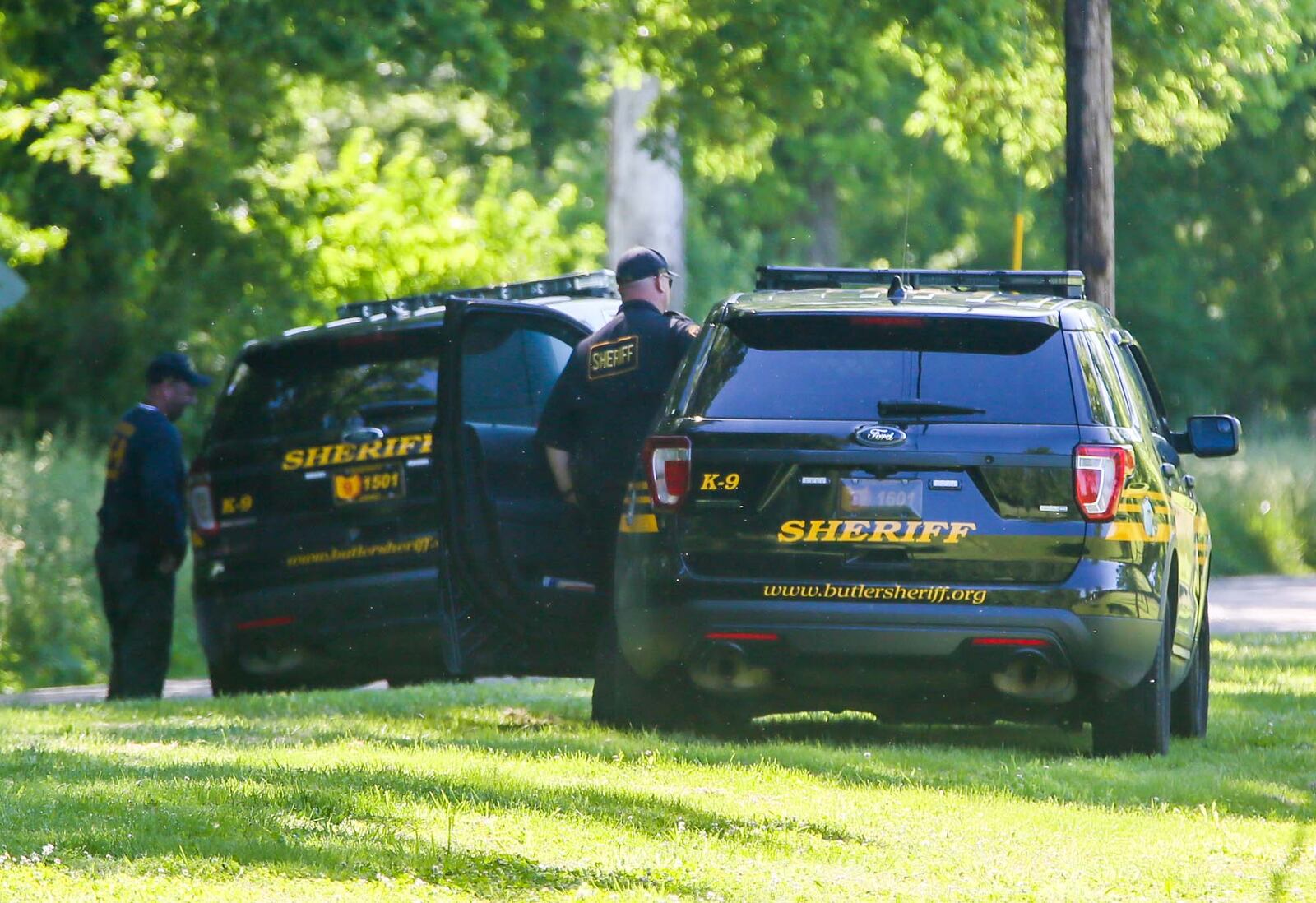 Investigators from the Butler County Sheriff's Office conducted a "secondary search" Tuesday May 30, at the scene of a fatal shooting in the 500 block of Warwick Road in St. Clair Twp. GREG LYNCH / STAFF