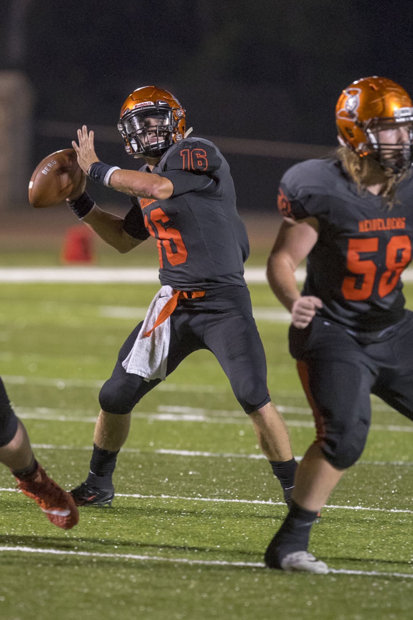 Heidelberg quarterback Trace Reynolds prepares to unload a pass behind teammate Malakye Nall during a Sept. 1 game against Olivet (Mich.) at Hoernemann Stadium in Tiffin. Reynolds directed the Student Princes to a season-opening 21-17 win. DOUG SAMPSON/HEIDELBERG ATHLETICS