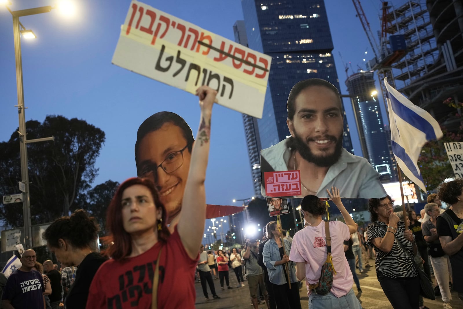 People take part in a protest demanding the end of the war and immediate release of hostages held by Hamas in the Gaza Strip, and against Prime Minister Benjamin Netanyahu's government in Tel Aviv, Israel, Saturday, June 7, 2025. (AP Photo/Ohad Zwigenberg)