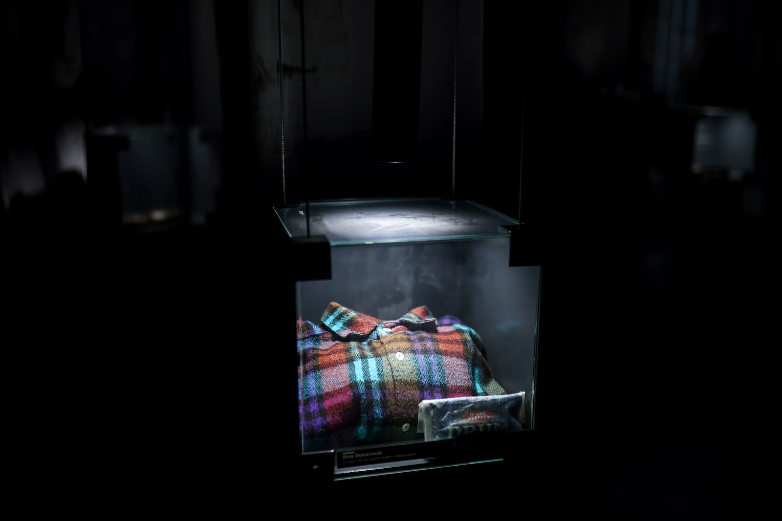 A shirt found in a mass grave is shown as a part of the exhibition "Lives Beyond the Fields of Death" opened at the Srebrenica Memorial Center in Potocari, Bosnia, Thursday, July 10, 2025. (AP Photo/Armin Durgut)