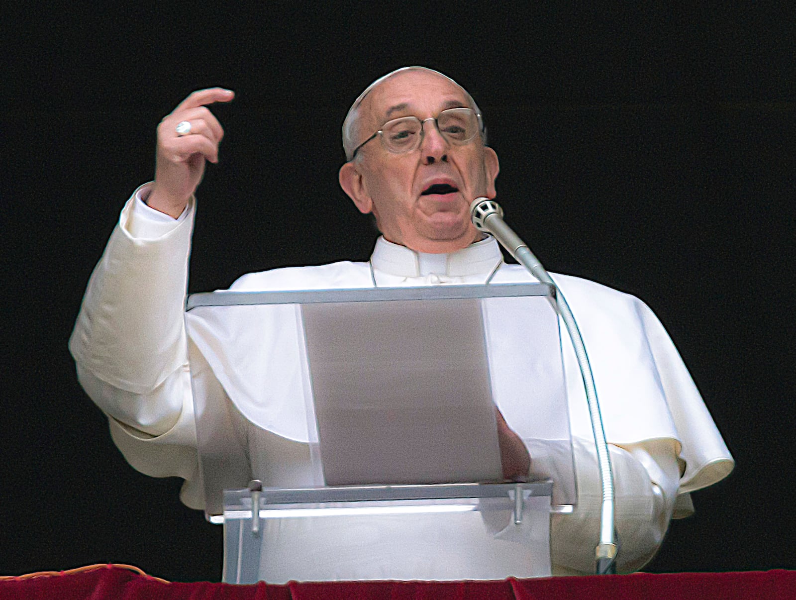 FILE - Pope Francis gestures on the first Sunday window appearance of his papacy to pray the Angelus and bless the faithful gathered in St. Peter's Square at the Vatican, Sunday, March 17, 2013. (AP Photo/Domenico Stinellis, File)