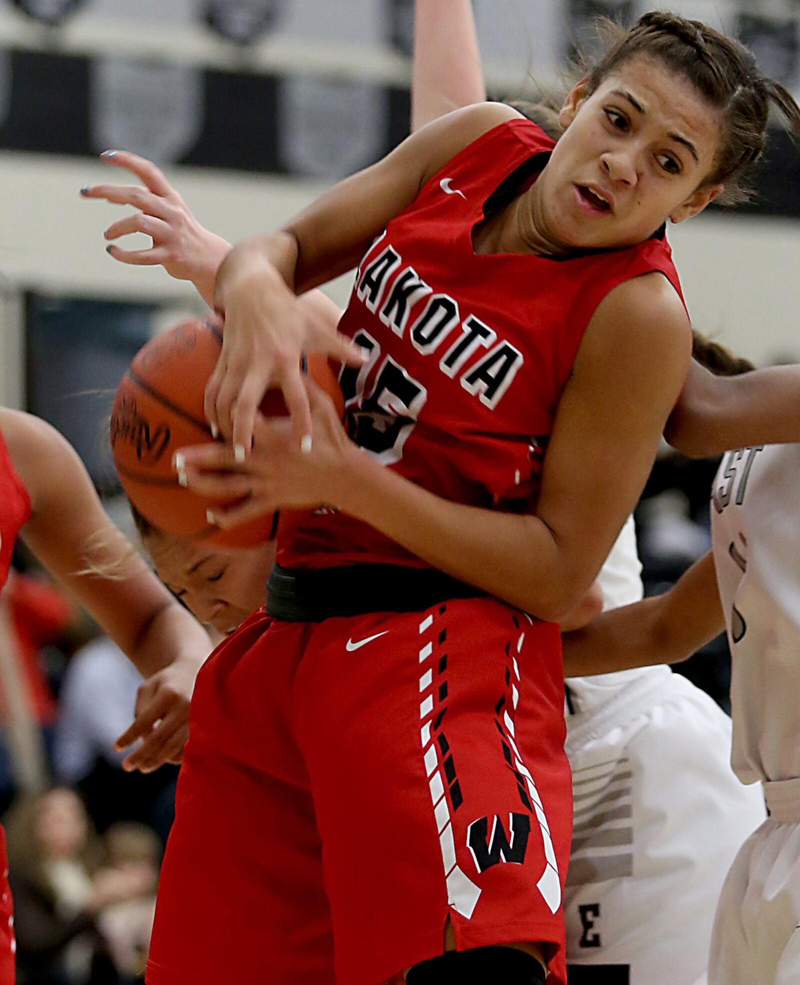 Lakota West guard Sarah Jones pulls down a rebound during Wednesday night’s game at Lakota East. CONTRIBUTED PHOTO BY E.L. HUBBARD