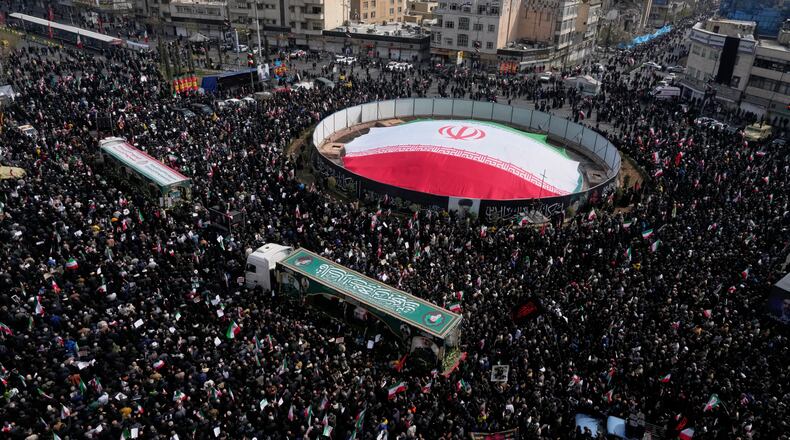 Mourners attend the funeral procession for senior Iranian military officials and some civilians killed during the U.S.-Israel campaign, in Tehran, Iran, Wednesday, March 11, 2026. (AP Photo/Vahid Salemi)