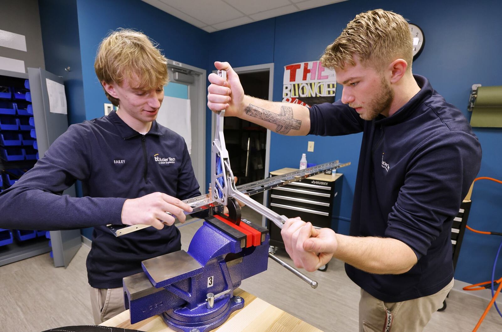 Seniors Preston Bailey, left, and Dominic Modinger work on constructing a section of an airplane during their aviation class at Butler Tech Wednesday, March 26, 2025 in Farifield Township. Students are building an airplane with parts and build plans supplied by Tango Flight. NICK GRAHAM/STAFF