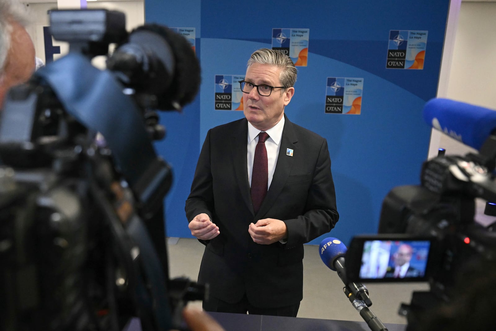 Britain's Prime Minister Keir Starmer speaks to the media as he arrives for the NATO summit of heads of state and government in The Hague Wednesday, June 25, 2025. (Ben Stansall/Pool Photo via AP)