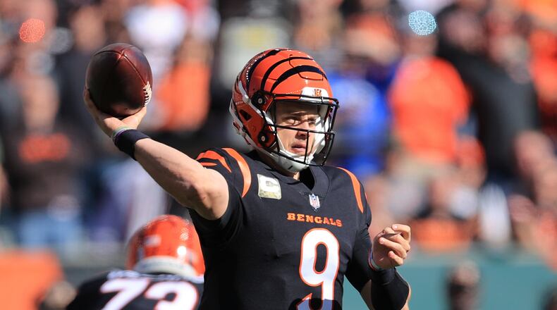 Cincinnati Bengals quarterback Joe Burrow (9) throws during the first half of an NFL football game against the Cleveland Browns, Sunday, Nov. 7, 2021, in Cincinnati. (AP Photo/Aaron Doster)