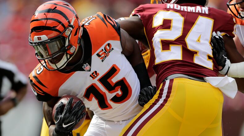 Cincinnati Bengals wide receiver John Ross (15) carries the ball against Washington Redskins cornerback Josh Norman (24) during a preseason NFL football game between the Cincinnati Bengals and Washington Redskins, Sunday, Aug. 27, 2017, in Landover, Md. (AP Photo/Mark Tenally)
