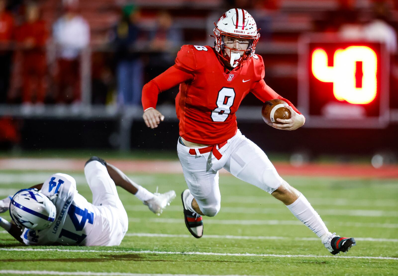Fairfield quarterback Talon Fisher carries the ball during their Division I Region 4 playoff football game against St. Xavier Friday, Oct. 28, 2022 at Fairfield Stadium. St. Xavier won 42-28. NICK GRAHAM/STAFF