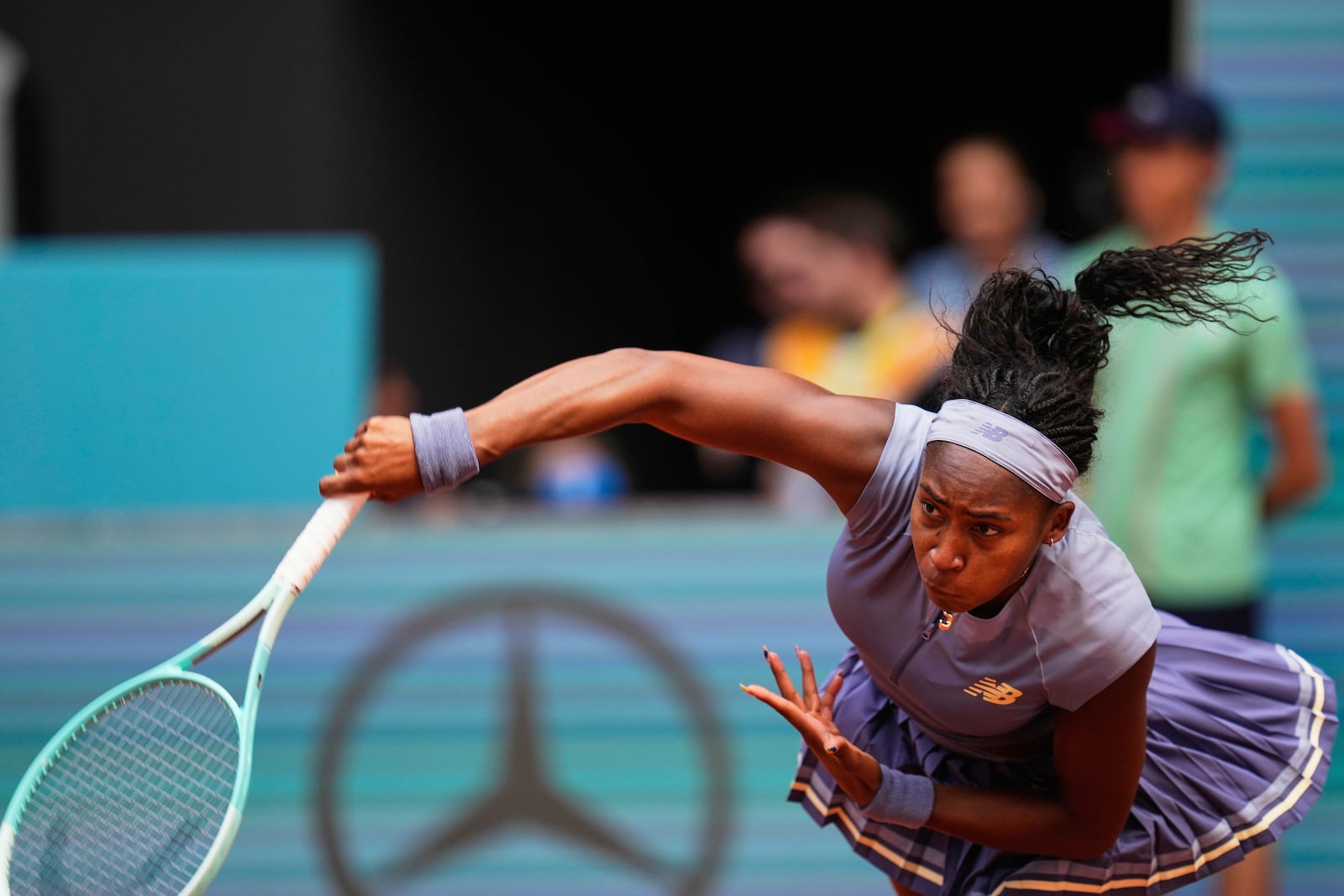 United States' Coco Gauff serves against Mirra Andreeva of Russia at the Madrid Open quarter-final tennis match in Madrid, Spain, Wednesday, April 30, 2025. (AP Photo/Manu Fernandez)