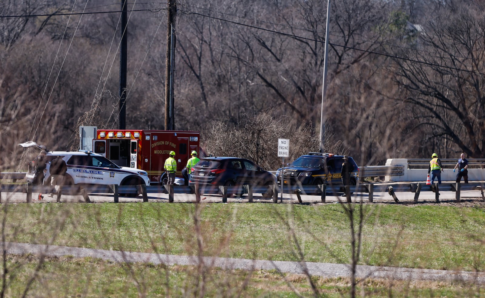 Middletown Fire Department responds to  the Ohio 122 bridge in Middletown to take two pedestrians struck by a vehicle to an area hospital. Ohio Department of Transportation crews had the bridge reduced to one lane, with flaggers positioned on both sides while they were cleaning debris from the river. NICK GRAHAM/STAFF