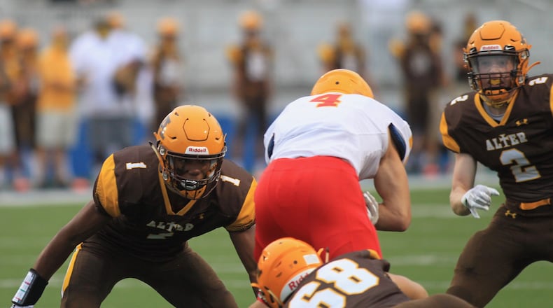 Alter's C.J. Hicks (1) prepares to make a tackle against Fenwick on Friday, Sept. 11, 2020, at Roush Stadium in Kettering. David Jablonski/Staff