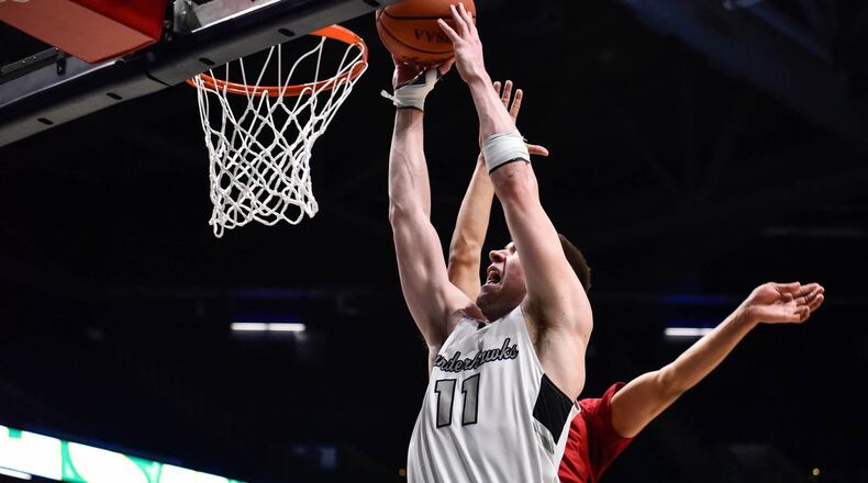 Lakota East’s Alex Mangold puts up a shot Wednesday, March 11, 2020 in their Division I Regional boys basketball semifinal against La Salle at Xavier University’s Cintas Center. In an effort to reduce the risk of spreading coronavirus (COVID-19), players were allowed to designate 4 family members to purchase tickets for the game and coaching staff was allowed 2 family members each. NICK GRAHAM / STAFF