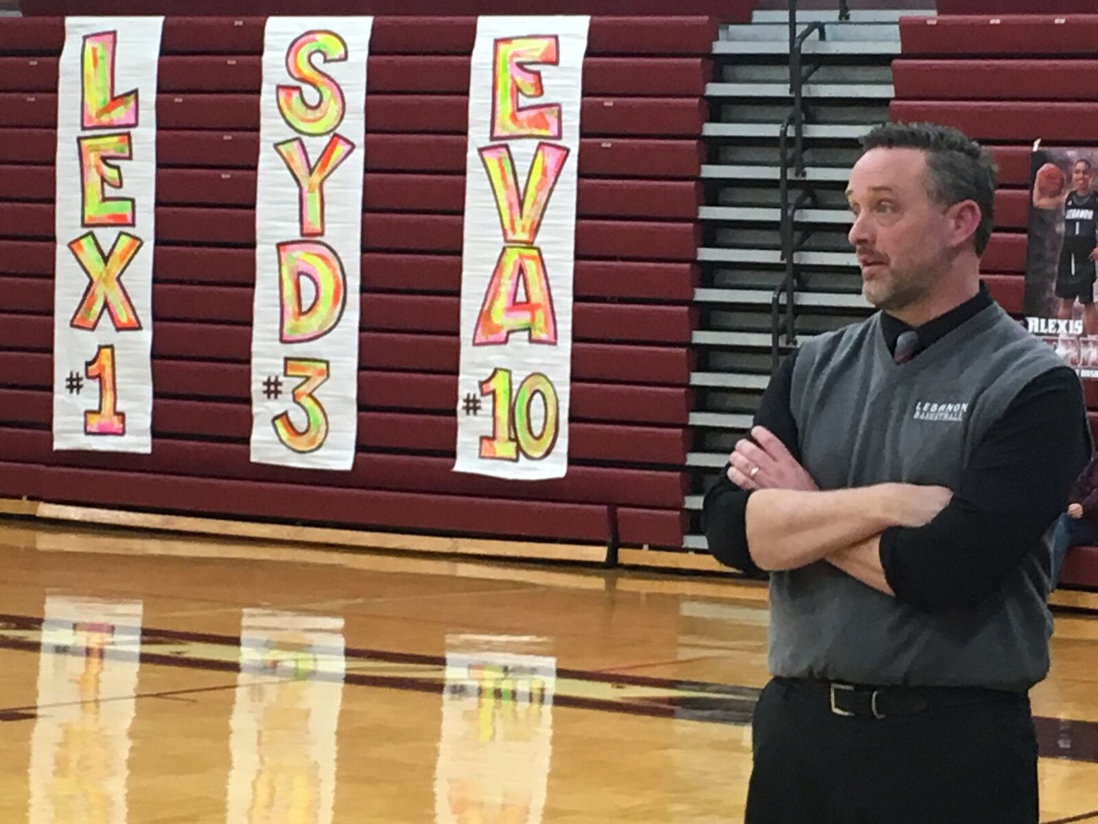 Lebanon coach Rob Hodges watches his team play Fairfield on Monday night at Lebanon. As the signs on the bleachers indicate, it was Senior Night for Alexis Straw (1), Sydney Hanna (3) and Eva White (10). RICK CASSANO/STAFF