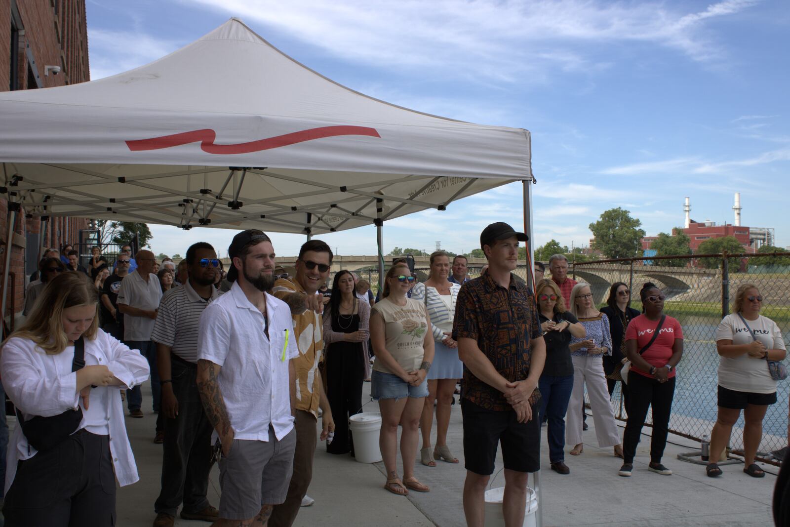 Jacob Duncan, Max Thomas and Robby Burgess (left to right) look upon the mural they painted as part of Often Seen Rarely Spoken at its dedication on July 2 at Spooky Nook at Champion Mill.