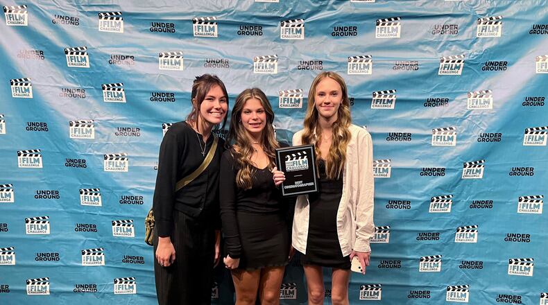Three area teens were recently honored as award winners for their video on human trafficking and the dangers of social media by the Academy of Cinematic Arts in Liberty Twp. From left to right are: Arebella Lloyd, recent graduate of Franklin High School; Madelyn Pergrem, freshmen at Lakota East Freshman School and Ainslee Pergrem, freshman at Franklin High School. Their video is now in national and international, teen short film contests. (Provided Photo\Journal-News)