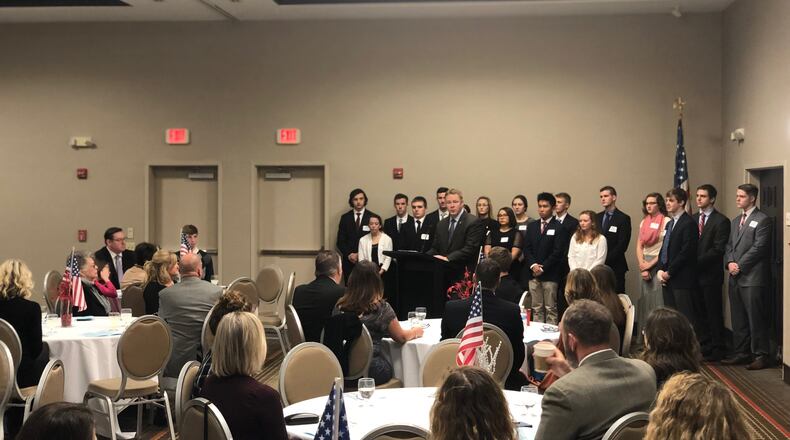 U.S. Rep. Warren Davidson, R-Troy, stands with U.S. Service Academy nominees during a reception in Miamisburg on Sunday