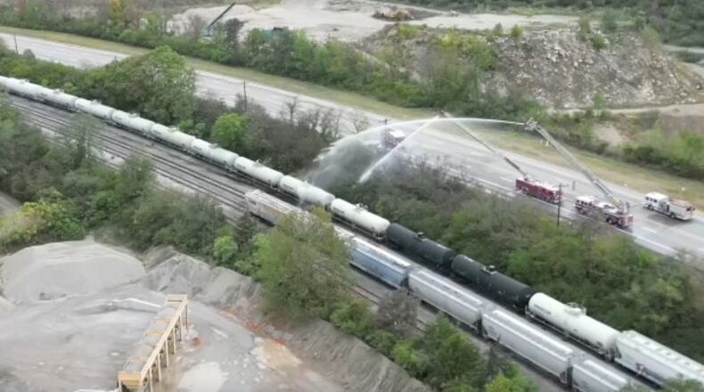 WCPO's Sky 9 captured firefighters putting water on a train car that appears to be releasing a chemical into the air in the Cleves and Whitewater Township area. Residents were asked to evacuate or remain indoors.