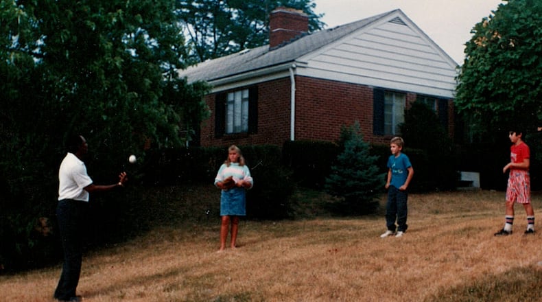 Minnesota Twins great Tony Oliva visits Kettering in 1988 and plays catch with David Jablonski, far right, and cousins. Photo by Mary Jablonski