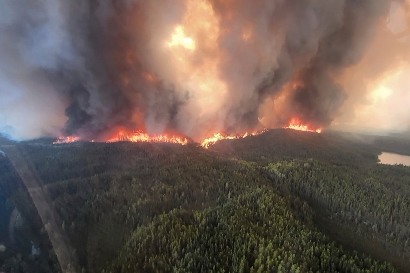 This photo provided by the Manitoba government shows wildfires in Sherridon, Manitoba, Canada, on Tuesday, May 27, 2025. (Manitoba government via AP)