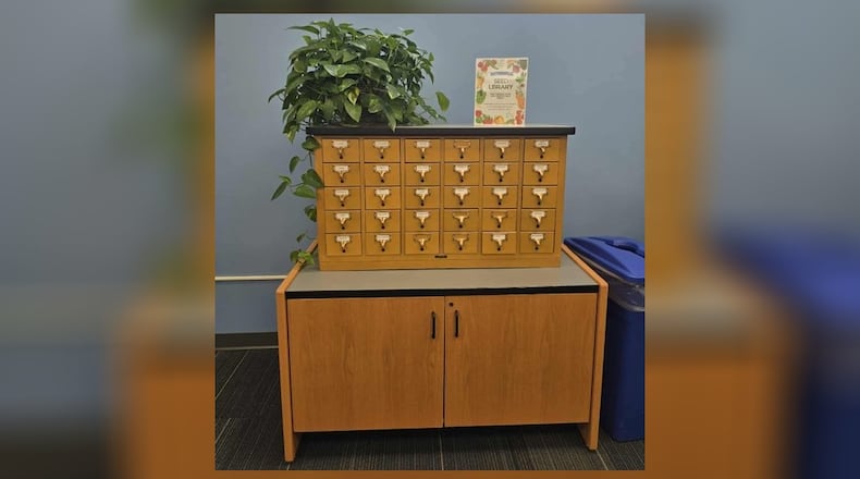 A vintage card catalog finds new life as a community seed library at the Springboro Public Library, 125 Park Lane, Springboro. Instead of index cards, each drawer now holds packets of seeds ready to be planted, shared, and grown by local families. KENDRA BEAN/CONTRIBUTED