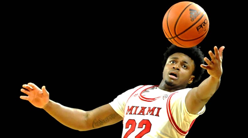 Miami's Morgan Safford, 22, pulls down a long rebound during the first half of a Mid American Conference game against Kent State at Millett Hall on Saturday, Jan.7. DAVID A. MOODIE/CONTRIBUTING PHOTOGRAPHER
