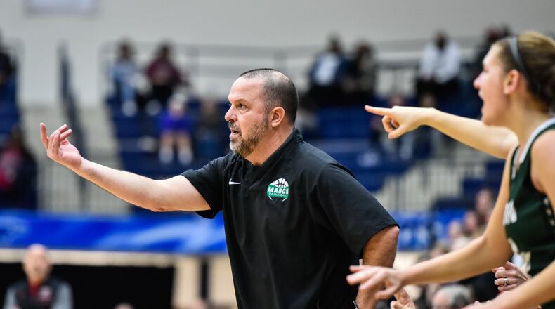 Mason girls basketball coach Rob Matula stands on the sideline during their Division I girls Regional basketball final against Lakota West Saturday, March 10 at Fairmont High School's Trent Arena in Kettering. Mason won 54-51. NICK GRAHAM/STAFF