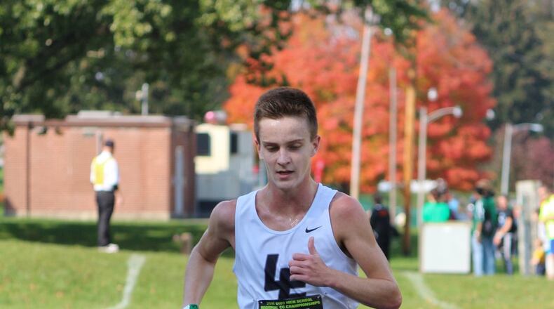 Lakota East’s Dustin Horter completes his Division I regional championship race Saturday in Troy. CONTRIBUTED PHOTO BY GREG BILLING