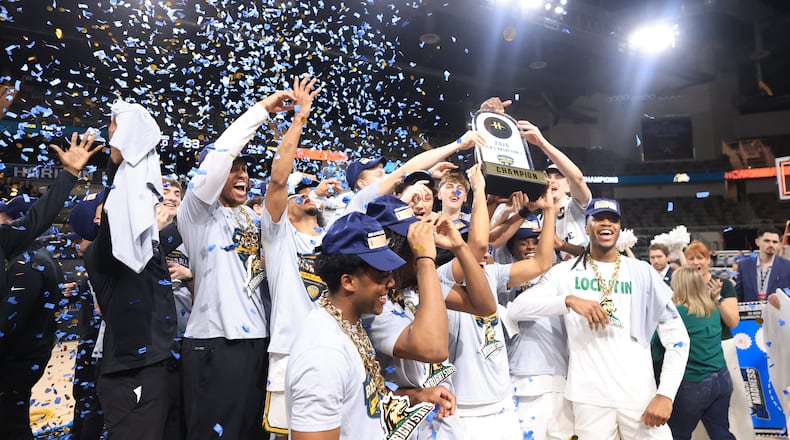 The Wright State University men's basketball team raises the trophy after beating Detroit Mercy 66-63 to win the Horizon League tournament championship on Tuesday, March 10, 2026 at the Corteva Coliseum in Indianapolis. HORIZON LEAGUE / CONTRIBUTED PHOTO