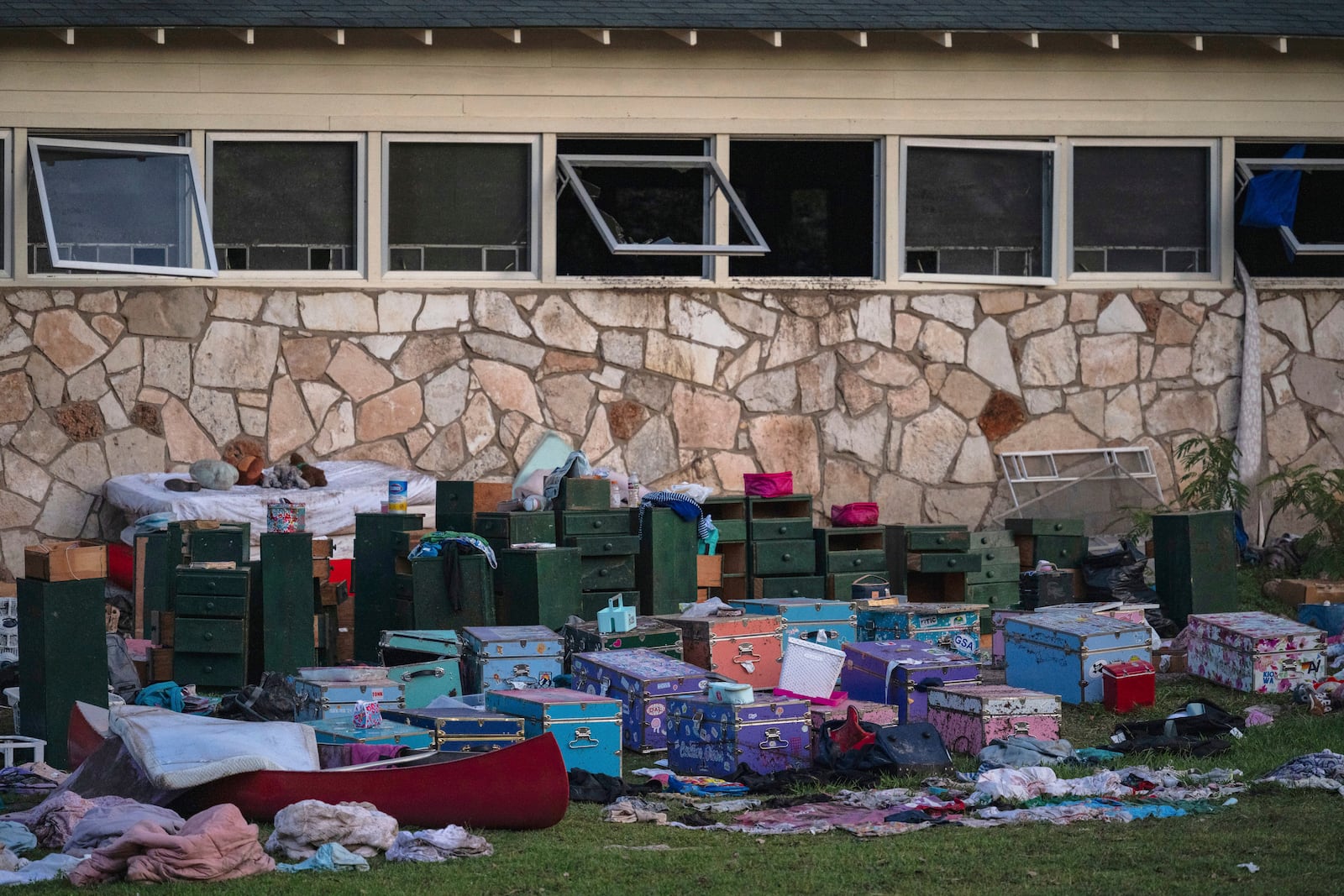 FILE - The belongings of campers sit outside one of Camp Mystic's cabins near the Guadalupe River in Hunt, Texas, on Monday, July 7, 2025, after a deadly flash flood swept through the area. (AP Photo/Eli Hartman, File)