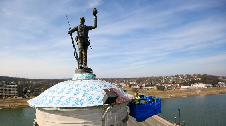 The Soldiers Sailors and Pioneers monument in downtown Hamilton is getting a new copper dome, a contingency not originally contemplated in the $361,000 restoration project. The new covering is expected to cost $72,000. GREG LYNCH / STAFF