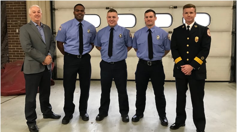 Middletown pinned badges on the city’s newest firefighter-EMTs Thursday at Fire Headquarters. Pictured (from left) are: Middletown City Manager Doug Adkins; firefighter-EMTs Antonio Pittman, Branden Cottrell and Joey Robertson; and Middletown Deputy Fire Chief David Adams. CONTRIBUTED