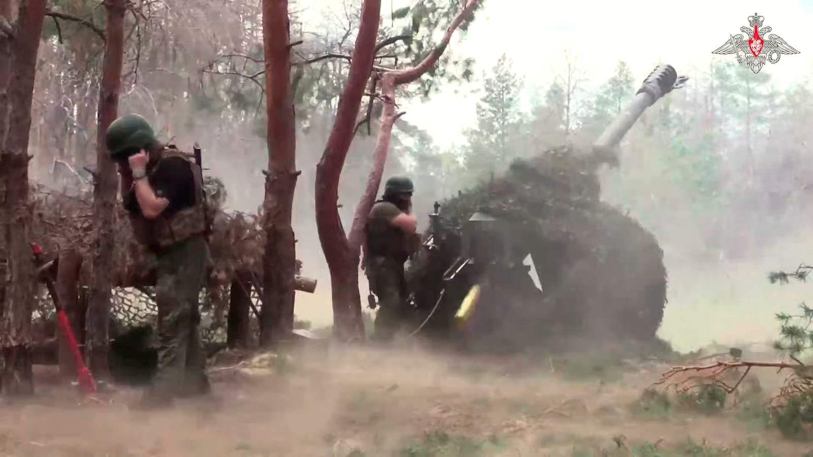 In this photo taken from a video released by the Russian Defense Ministry on Wednesday, July 9, 2025, Russian soldiers fire from D-30 howitzer towards Ukrainian positions in an undisclosed location in Ukraine. (Russian Defense Ministry Press Service via AP)