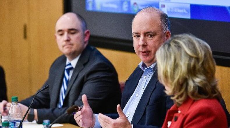 Mason Schools officials said residents will not be asked for a school tax hike in 2019 but may see a tax levy beyond that year. Mason Board of Education member Kevin Wise (center) said the district has had to carry the funding burden created by the state’s phasing out of tax credits — on top of sweeping budget cuts in personnel and programs.