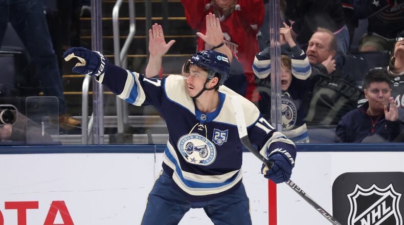 Columbus Blue Jackets forward Mason Marchment celebrates his goal against the New Jersey Devils during the first period of an NHL hockey game in Columbus, Ohio, Wednesday, Dec. 31, 2025. (AP Photo/Paul Vernon)