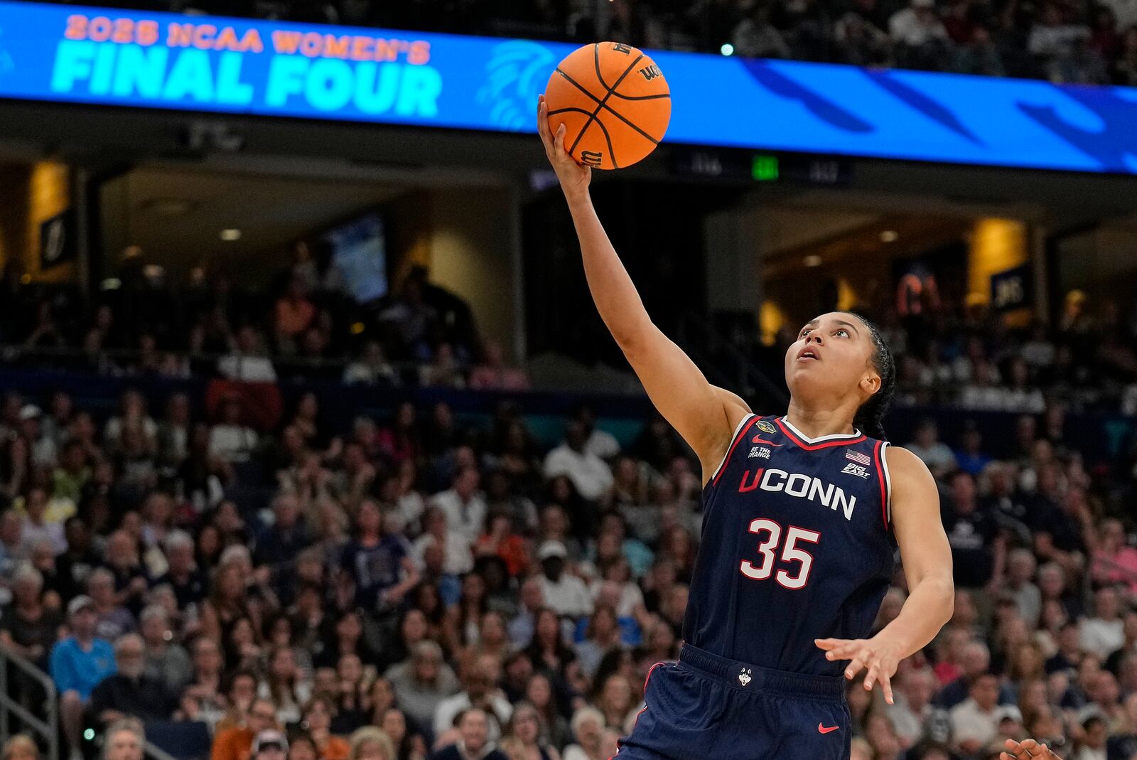 UConn guard Azzi Fudd (35) puts up a shot against South Carolina during the first half of the national championship game at the Final Four of the women's NCAA college basketball tournament, Sunday, April 6, 2025, in Tampa, Fla. (AP Photo/Chris O'Meara)