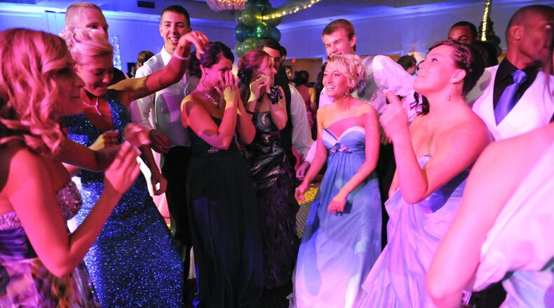 Students nowadays have creative ways to ask dates to prom, and the Fairfield Police Department and the Fairfield Prevention Coalition want to see how creative students at Fairfield High School will be in their “prom-posals.” Pictured are Fairfield High School students enjoying the prom at the Millenium Hotel in Cincinnati in April 2012. FILE