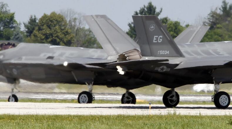Two F-35s that visited the the Vectren Dayton Air Show in 2016. Pilots of the F-35 Joint Strike Fighter will see a reduction in the weight of their helmets as the program office at Wright-Patterson Air Force Base works to make them safer. TY GREENLEES / STAFF FILE PHOTO