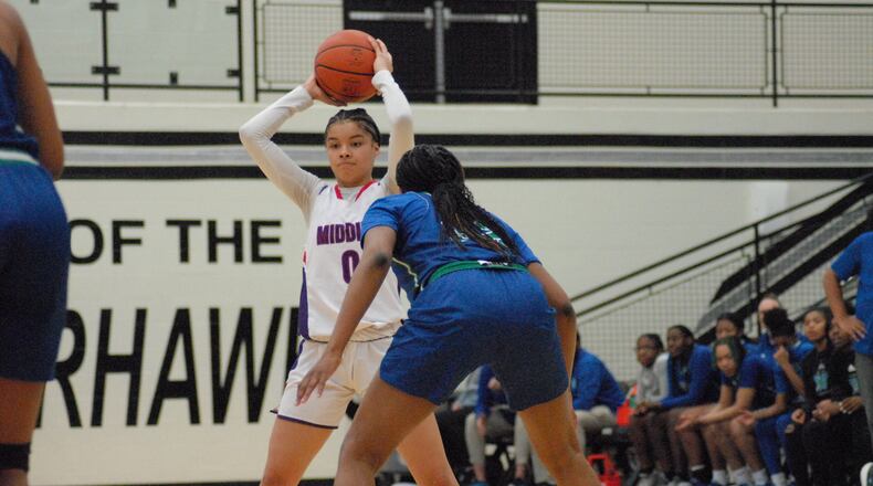 Middletown senior Derranae Aldridge looks for a passing lane against Winton Woods on Monday night at Lakota East. The Middies fell 47-41 in a Division I sectional opener. Chris Vogt/CONTRIBUTED