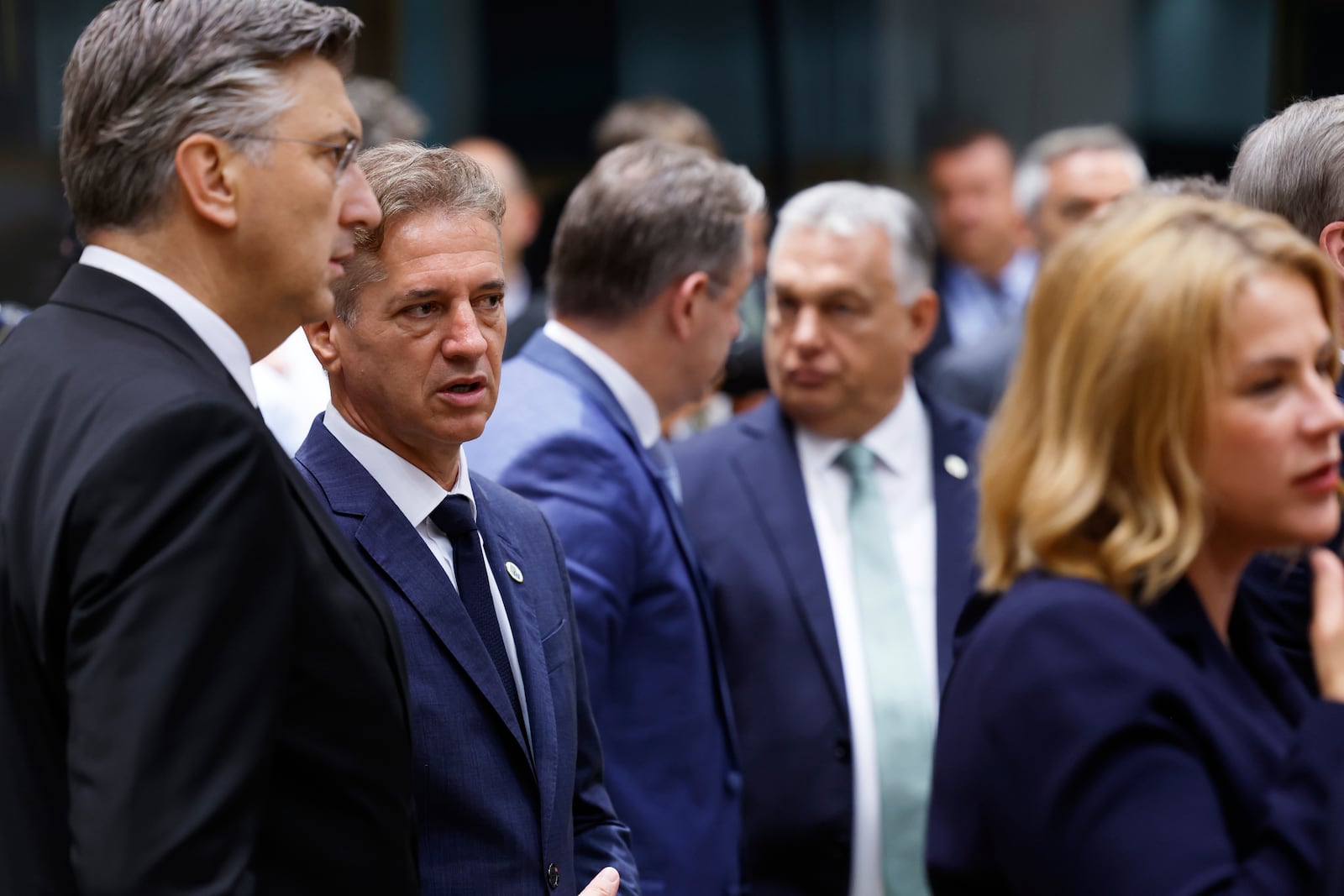From left, Croatia's Prime Minister Andrej Plenkovic, Slovenia's Prime Minister Robert Golob, Belgium's Prime Minister Bart De Wever, Hungary's Prime Minister Viktor Orban and Latvia's Prime Minister Evika Silina attend a round table meeting at an EU summit in Brussels, Thursday, June 26, 2025. (AP Photo/Geert Vanden Wijngaert)